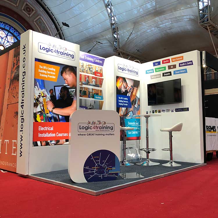 Small Shell Scheme Stand with Custom Modular Graphics | PHEX | Logic4Training | Motive Exhibitions | why choose exhibition stand hire?